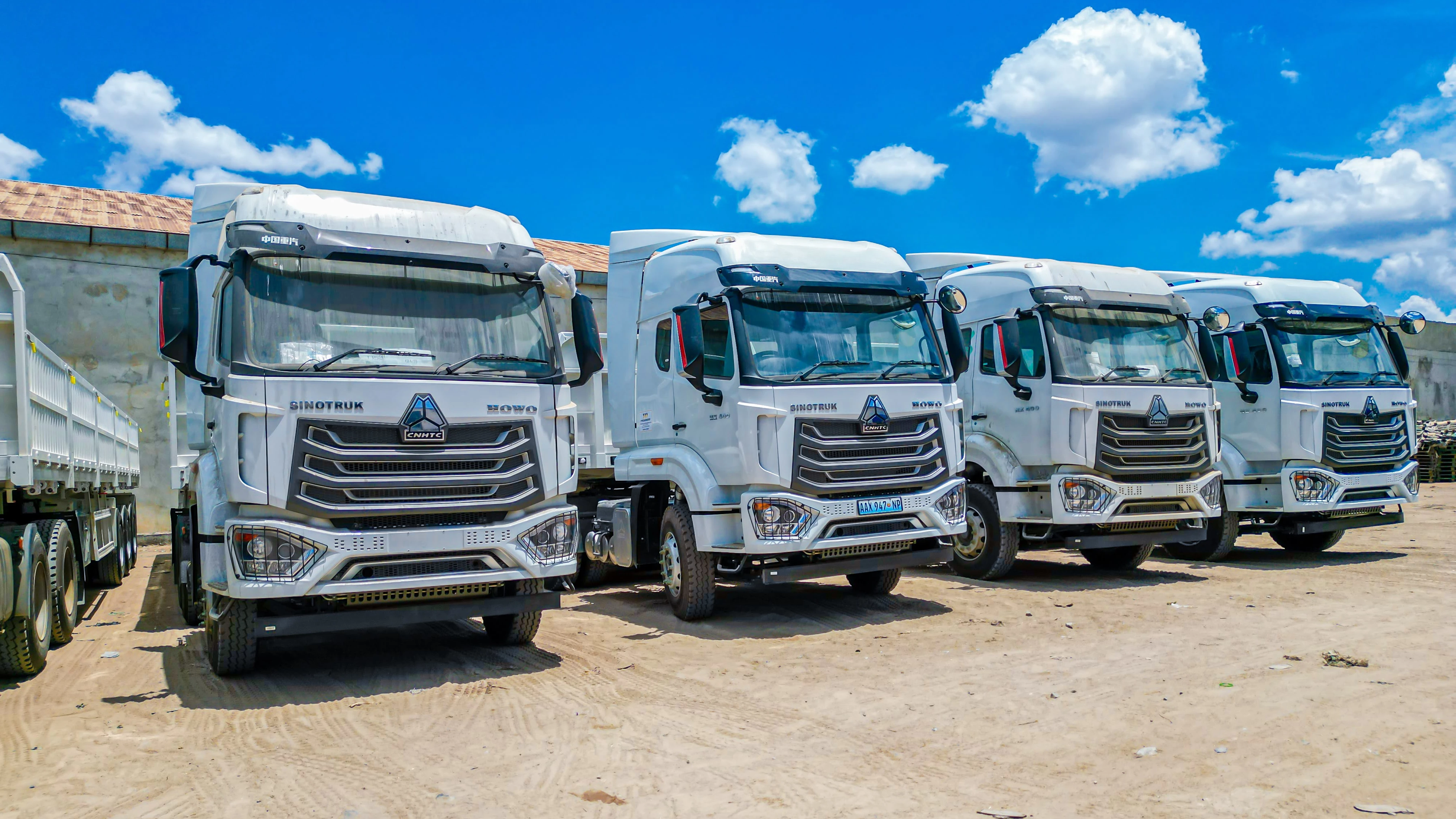 Fleet of white Sinotruk trucks available for sale